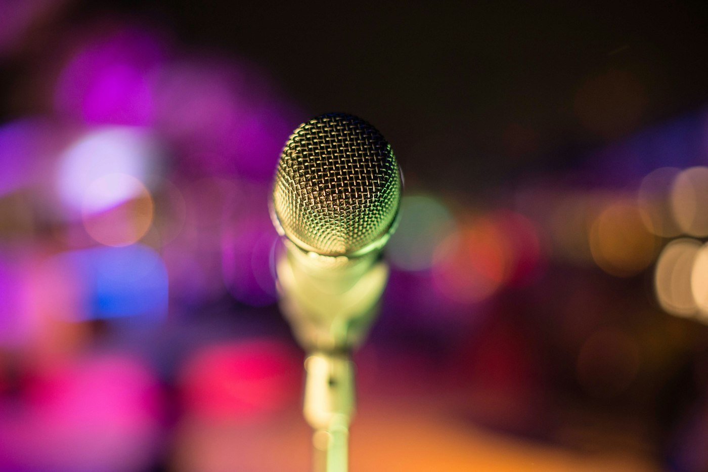 Microphone in front of soft coloured lights
