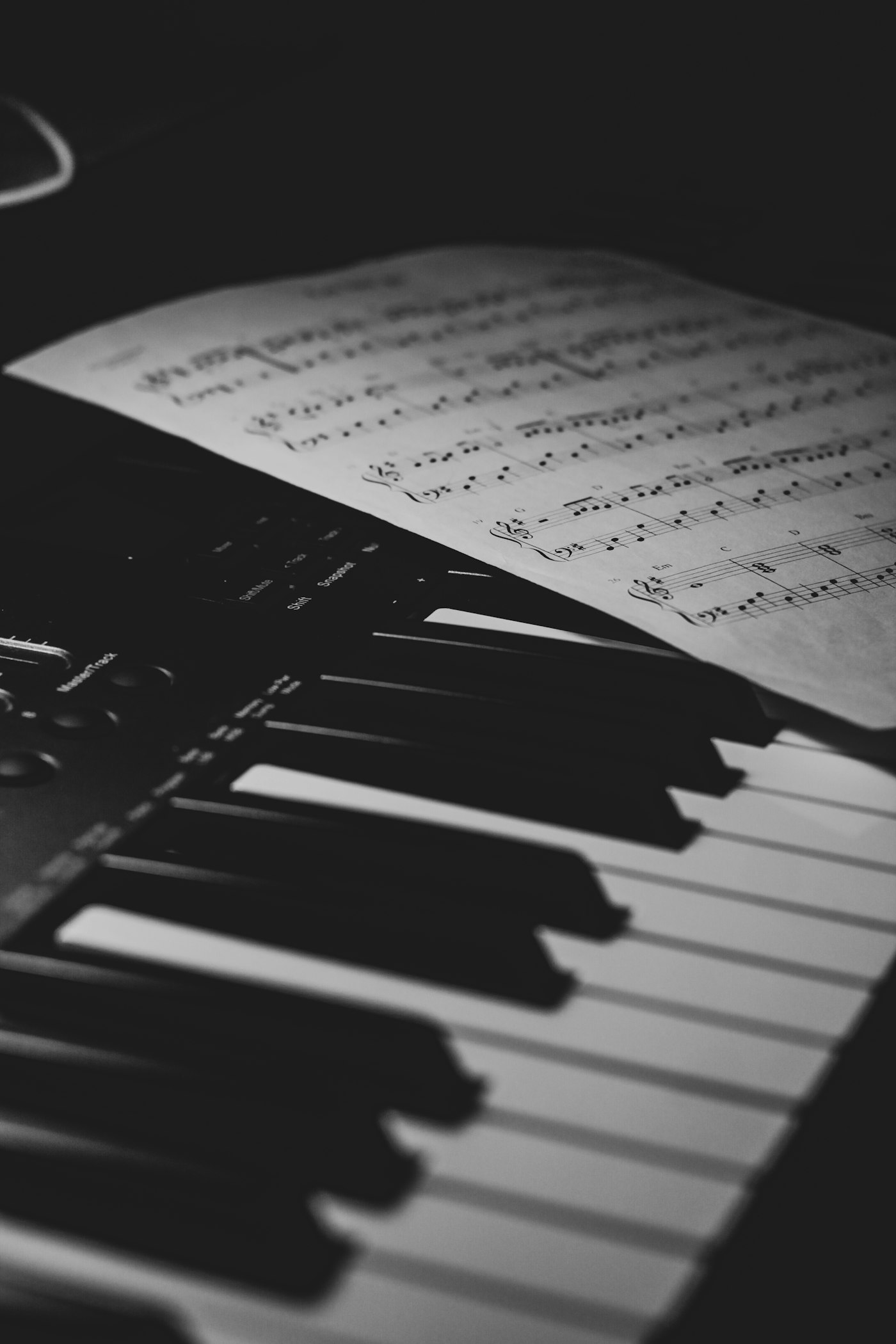 Piano keyboard with sheet music